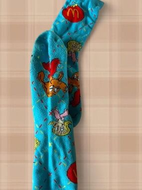 blue socks with cartoon characters